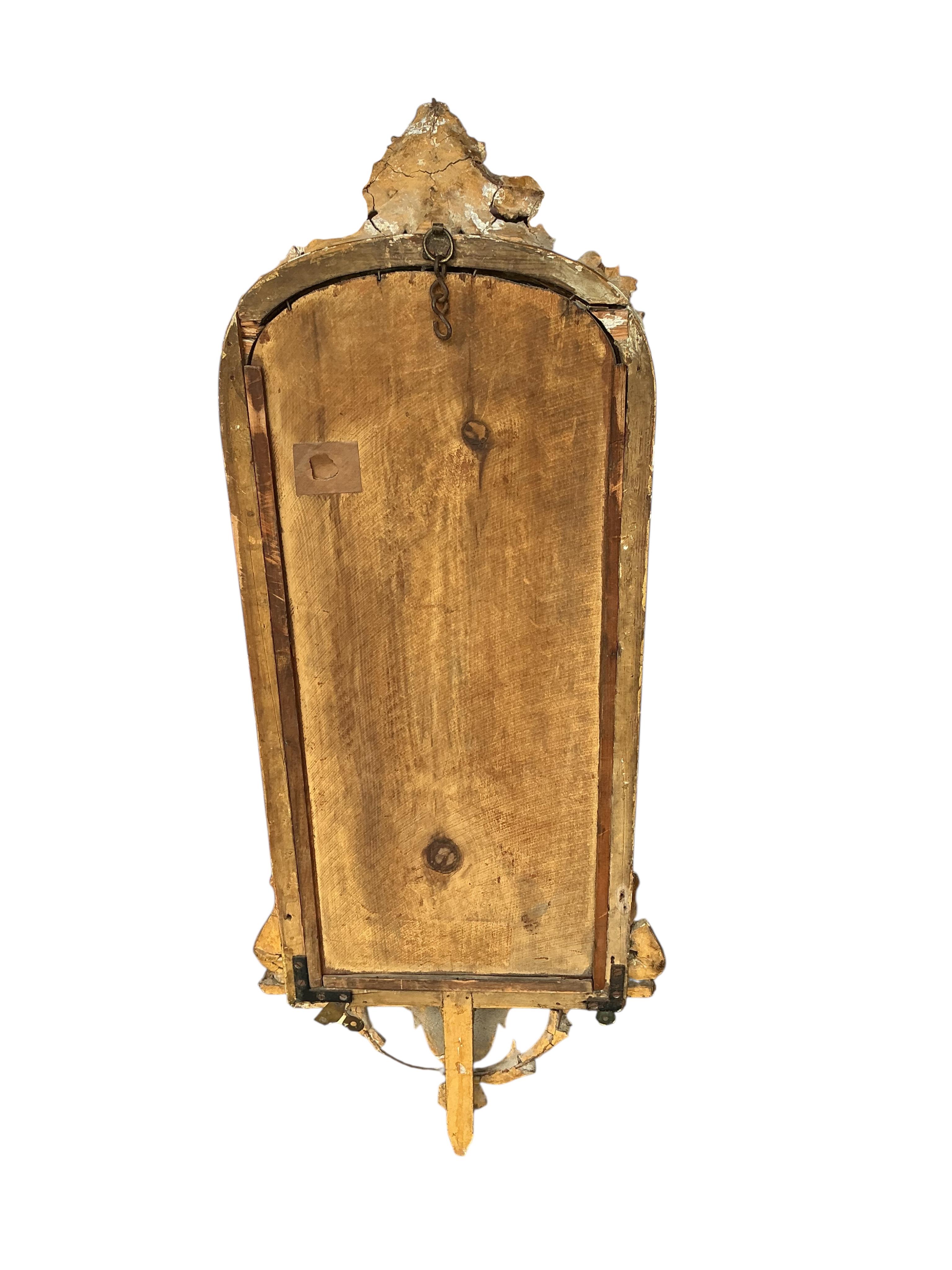 A Victorian giltwood and composition wall mirror, width 38cm, height 96cm, some damage